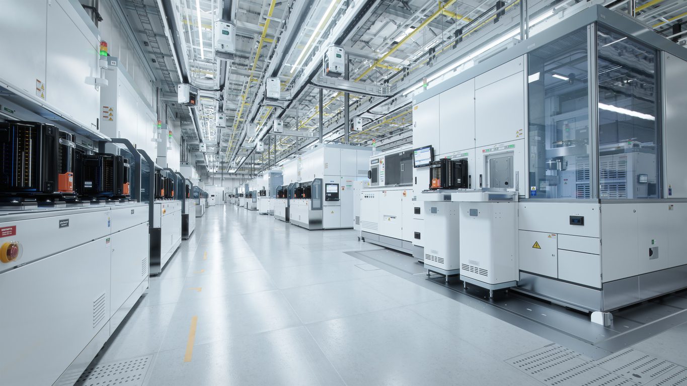 interior of a bright white chip factory with shiny floors and pristine clean machines.